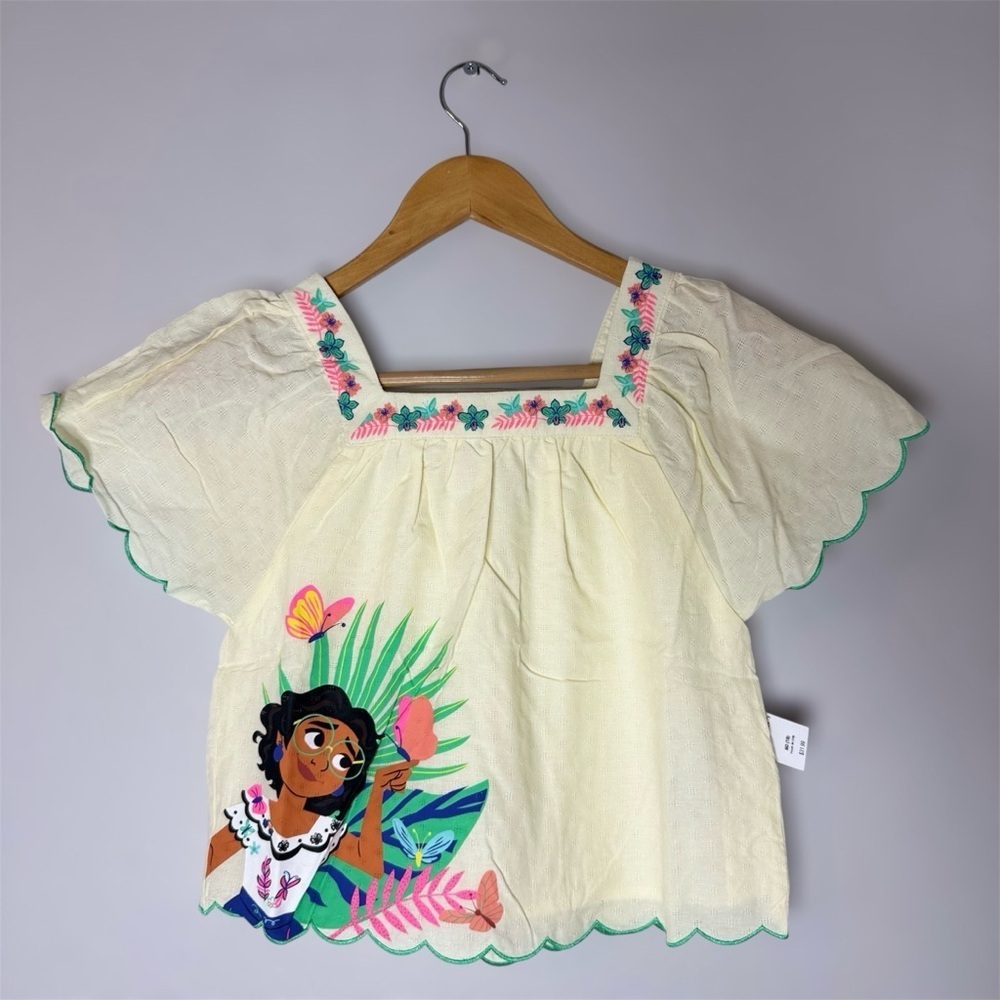 New DISNEYS ENCANTO MIRABEL SHIRT Kids Cream Top w/ Colorful Print Med (7/8)